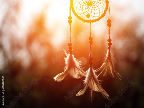 Dream catcher in the wind and blurred bokeh background with selective focus, native american