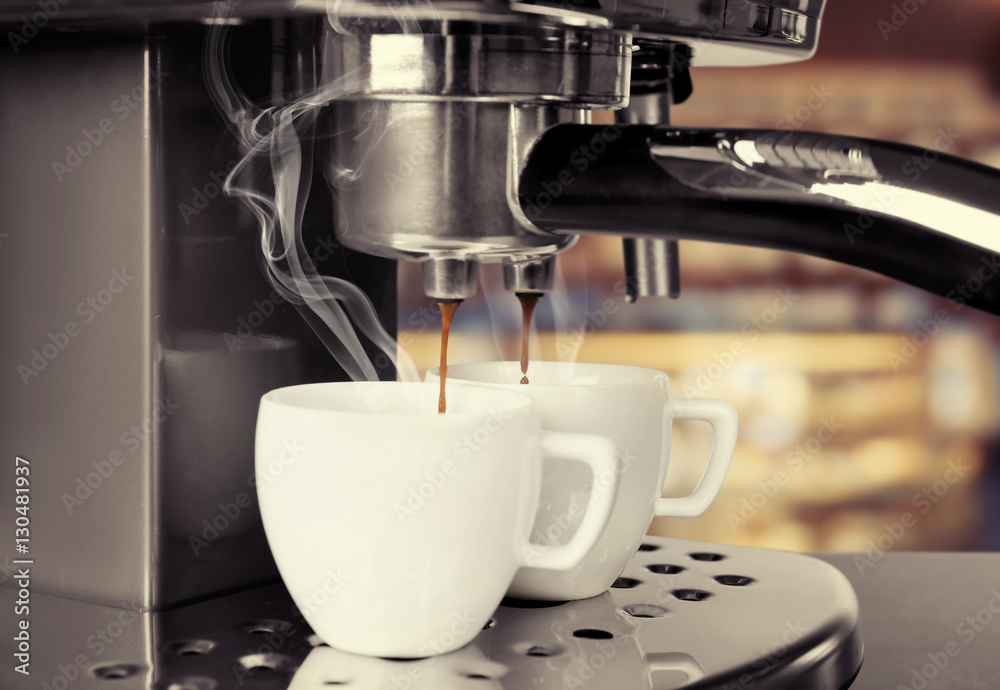 Preparing of aromatic espresso in modern coffee machine, closeup Preparing of aromatic espresso in modern coffee machine, closeup