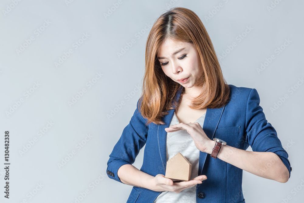 beautiful asian businesswomanwith house paper model with free copyspace for your text house concept beautiful asian businesswomanwith house paper model with free copyspace for your text house concept