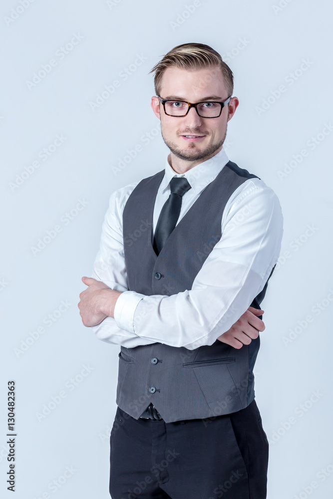 Portrait of  happy smiling businessman standing with arms crosse