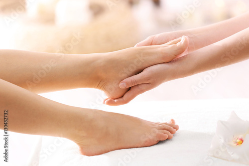Foot massage in spa salon  closeup