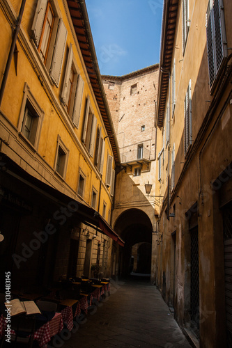 narrow street and old houses in Siena