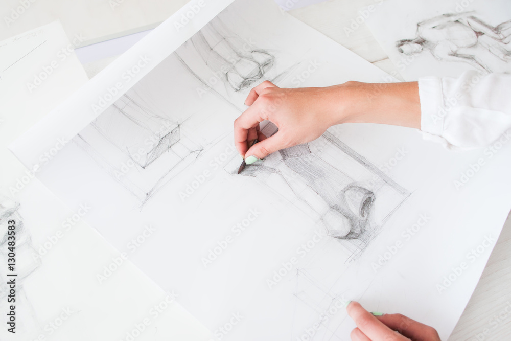 Aspiring artist learning to draw details, free space. Student painter