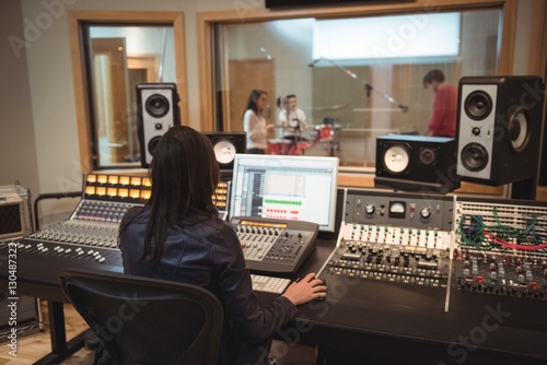 Audio engineer using sound mixer