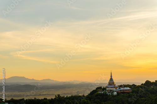 Tha Ton Temple set amid green mountains with sunset sky,Place for religious practices of Thailand © kedsirin