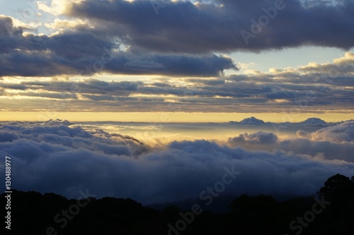 Morning mountain landscape with waves of fog. Dreamy sunrise on