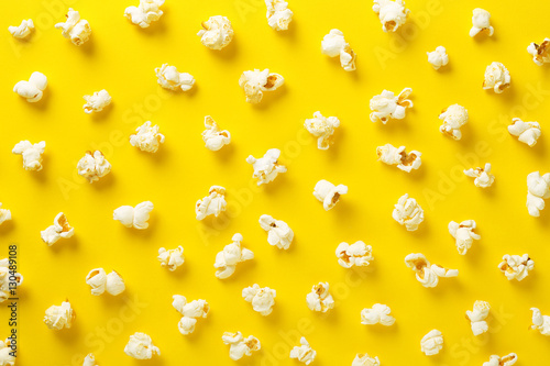 Photography Popcorn pattern on yellow background. Top view