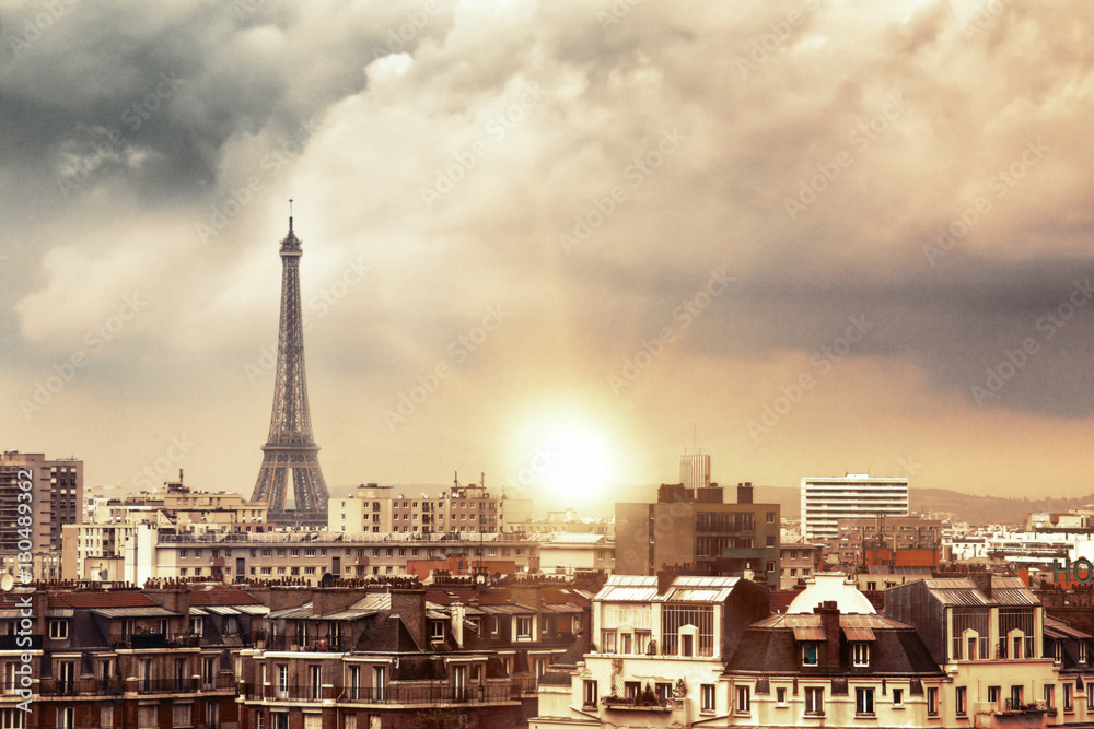 Fototapeta premium Eiffel tower and Paris city view form the roof. Eiffel Tower from Champ de Mars, Paris, France. Beautiful Romantic background.