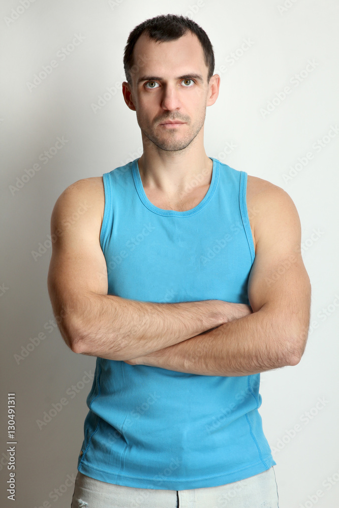 Young male athlete posing in studio. Young male athlete posing in studio.