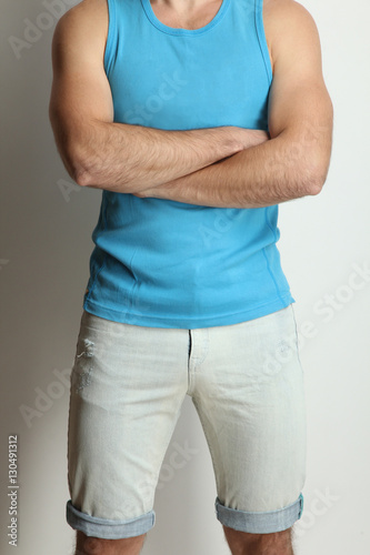 Young male athlete posing in studio.