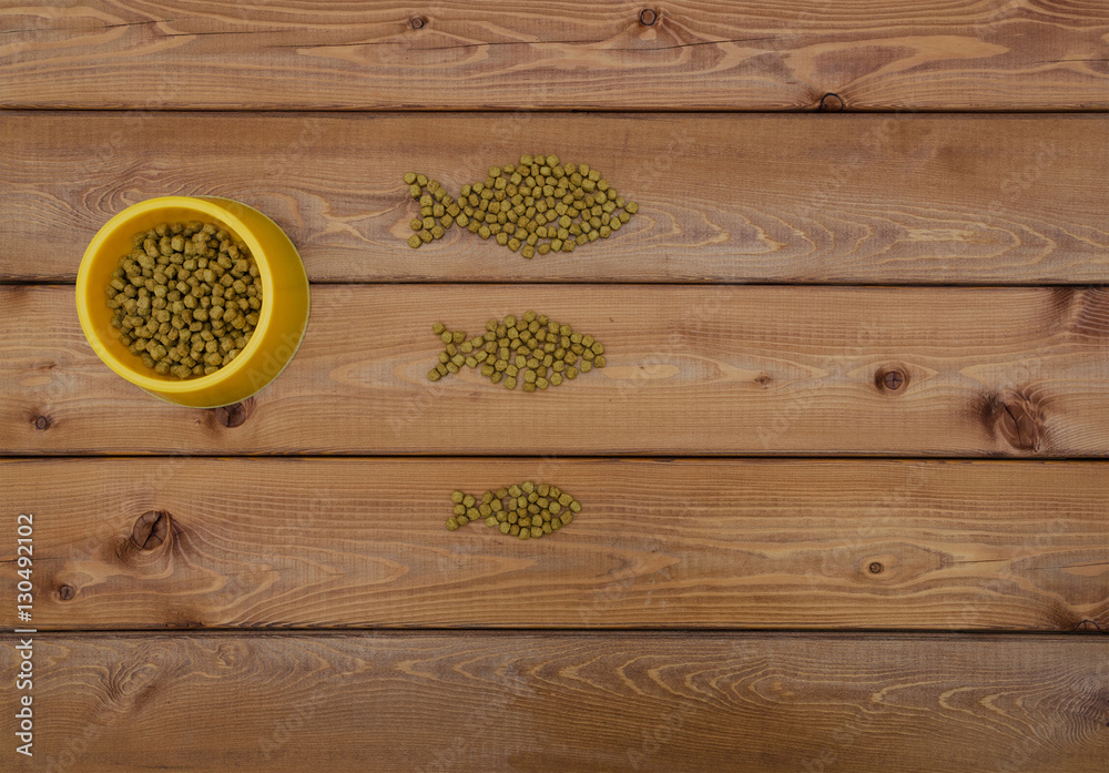 Cat food in bowl and on wood background StockFoto Adobe Stock