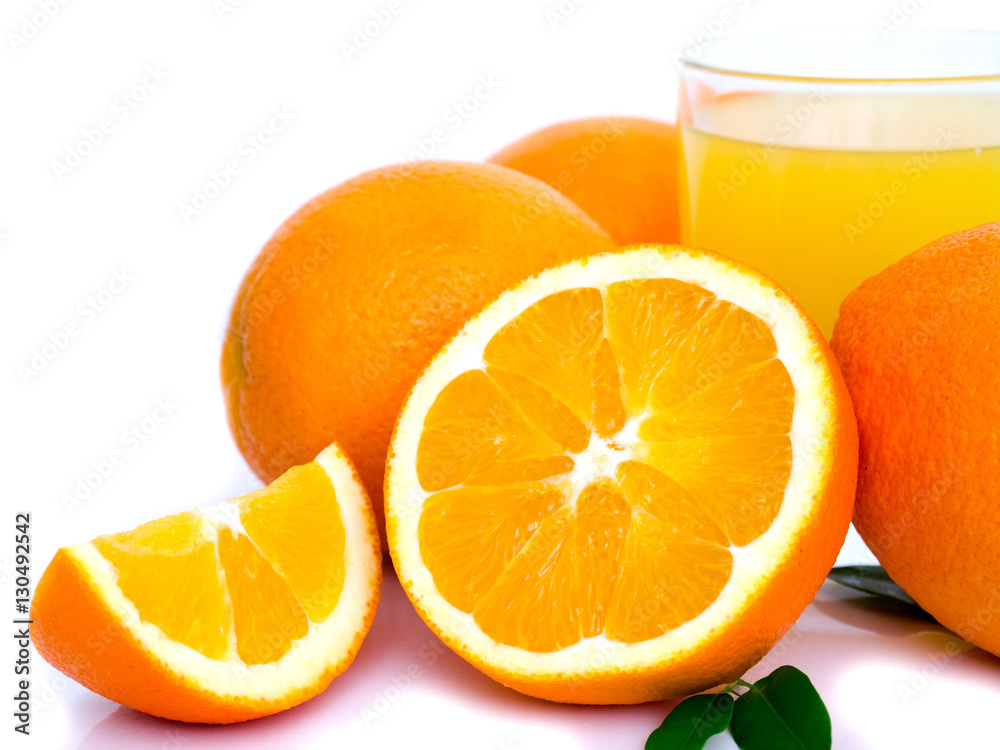 orange fruit and orange juice in glass isolated on white background
