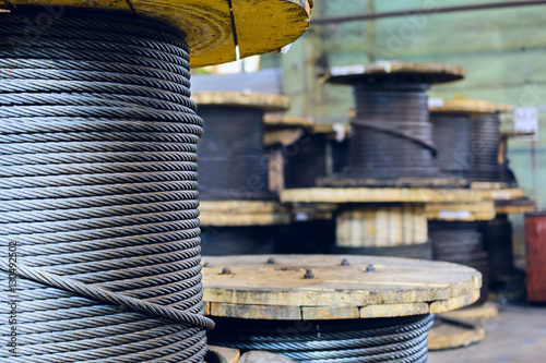 Large cable reels stocked in the factory premises.