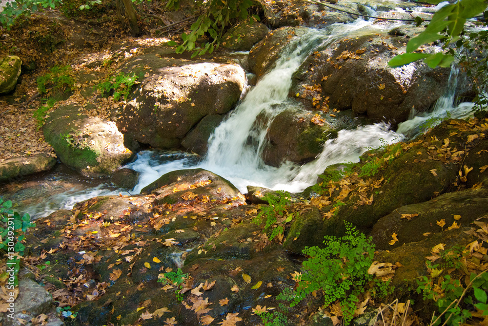 Mountain river flowing through rocks