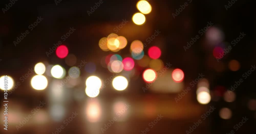 Blurry night shot of city traffic. Defocused cars of commuters Blurry night shot of city traffic. Defocused cars of commuters