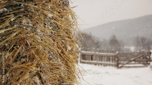 Haystack in winter on the farm under snow