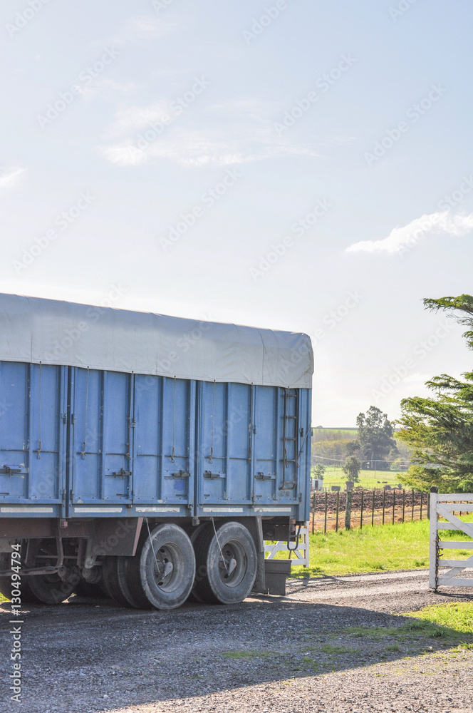 Truck coming out the farm gate entrance