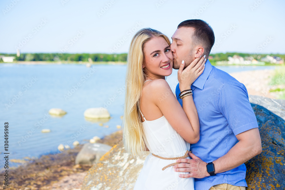 portrait of beautiful couple in love hugging and kissing on the portrait of beautiful couple in love hugging and kissing on the