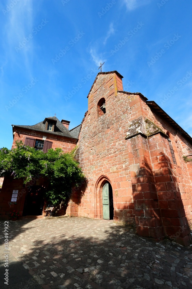 Red bricks church in Collonges-La-Rouge, red village in Corrèze , France
