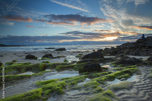 Sunset over Scottish sea with stones