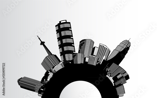 Round black and white cityscape with skyscrapers placed around.