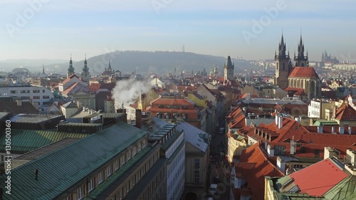 Tiled roofs and gothic spires of Old town in Prague on a sunny day, Czech Republic