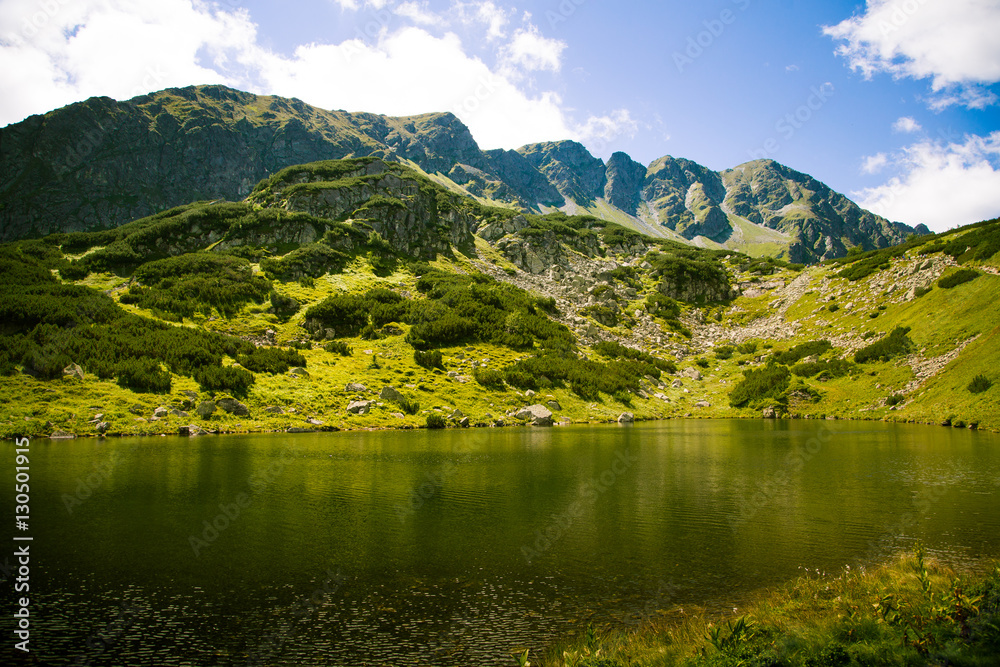 Fototapeta premium A beautiful mountain lake landscape in Tatry, Slovakia