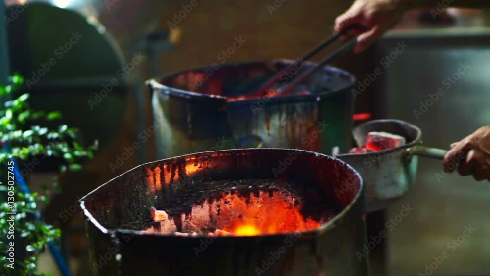 Burning charcoal on fire in stove for cooking Burning charcoal on fire in stove for cooking