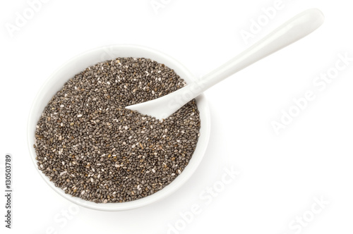 Nutritious chia seeds isolated over a white background