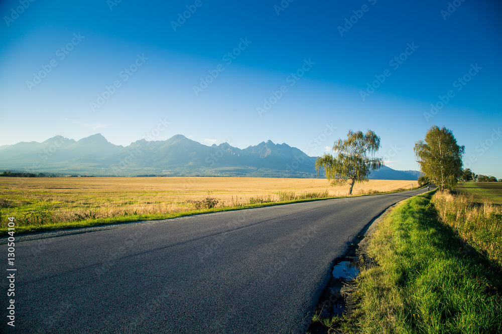 A beautiful mountain landscape with a road