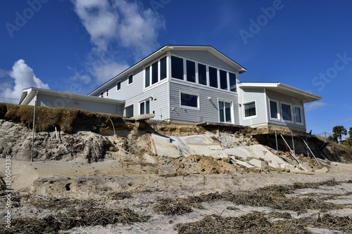 Beach erosion and damage caused by hurricane Matthew hitting along the east coast of Florida, USA photo