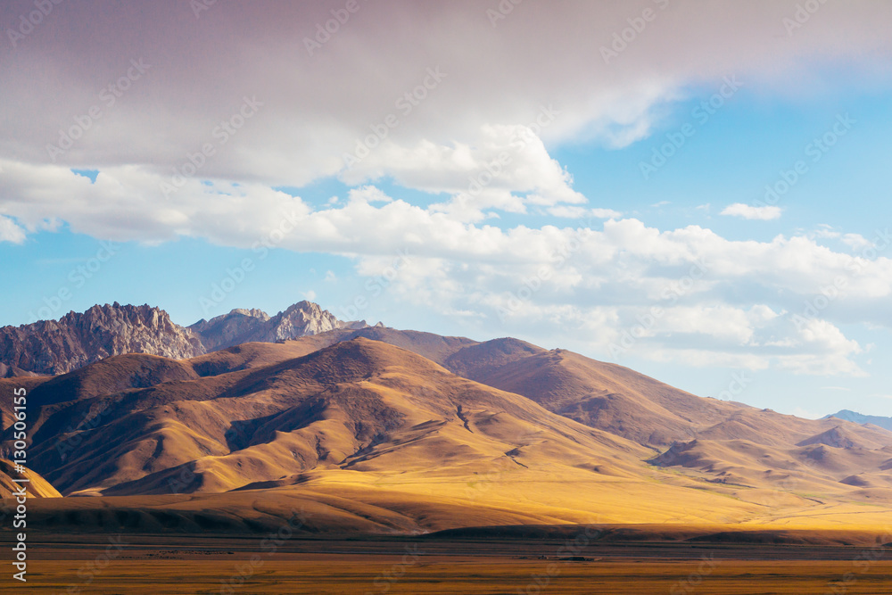 The magnificent view of colourful Tien Shan (Tian Shan) mountain  landscape in the east of Kyrgyzstan, on the way to Chinese Border of Xinjiang province. Central Asia