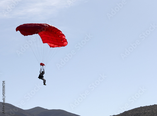Parachute jumper floating to the ground