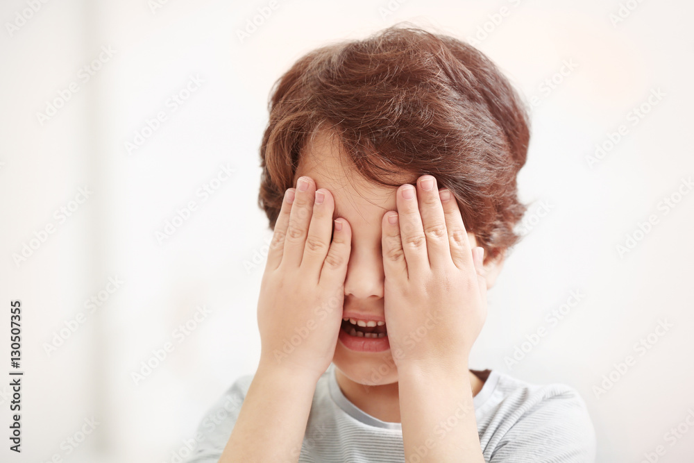 Cute emotional little boy on light blurred background Cute emotional little boy on light blurred background