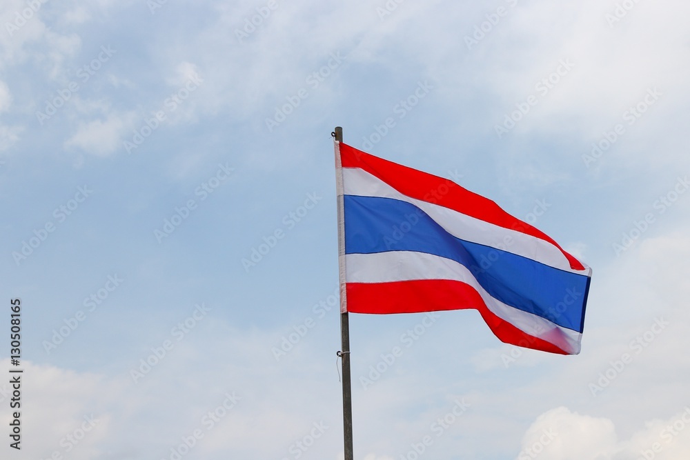 Thai flag, waving in the wind with beautiful with blue sky background