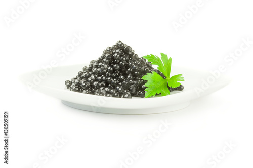 Black caviar, luxurious delicacy isolated on a white background with clipping path
