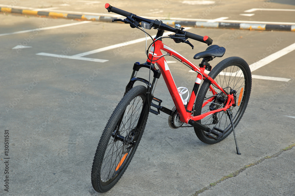 closeup of mountain bike at parking lot closeup of mountain bike at parking lot