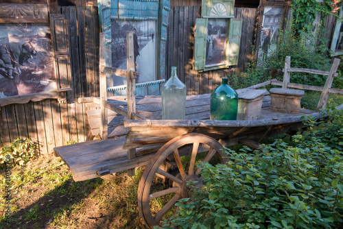 Wallpaper Mural Old and used wagon standing near green bushes Torontodigital.ca