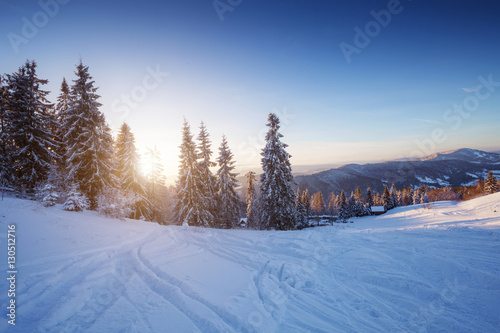 Winter landscape in mountains at sunset