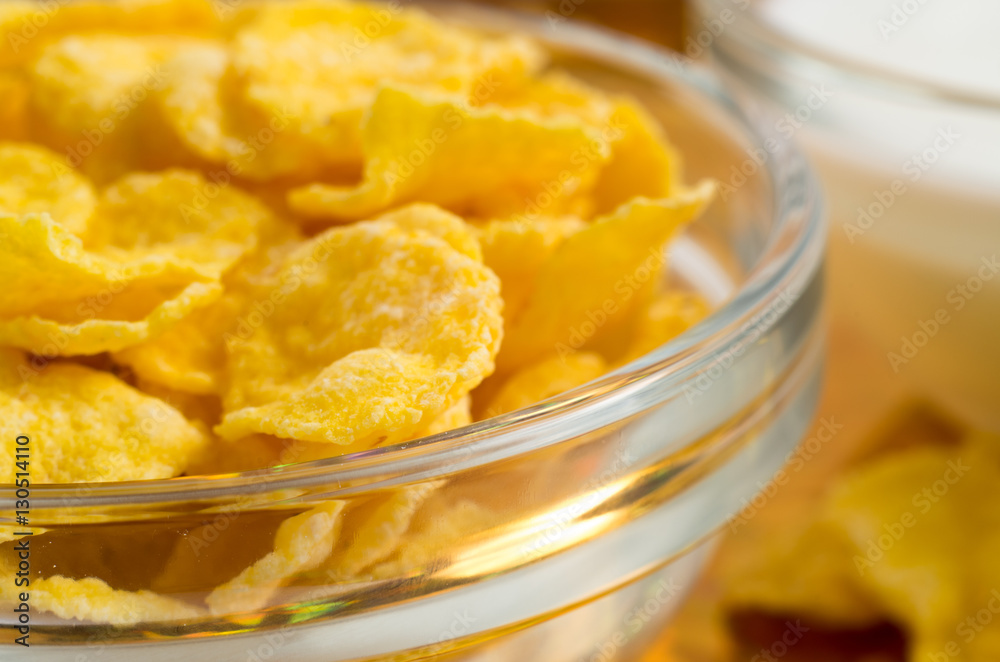 Blurred image of a glass cup with cornflakes Blurred image of a glass cup with cornflakes