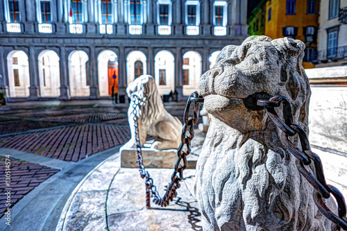 Piazza Vecchia, Citta Alta, Bergamo, Italy. Night view on the square with the beautiful fountain in the center of the square illuminated by night lights. photo