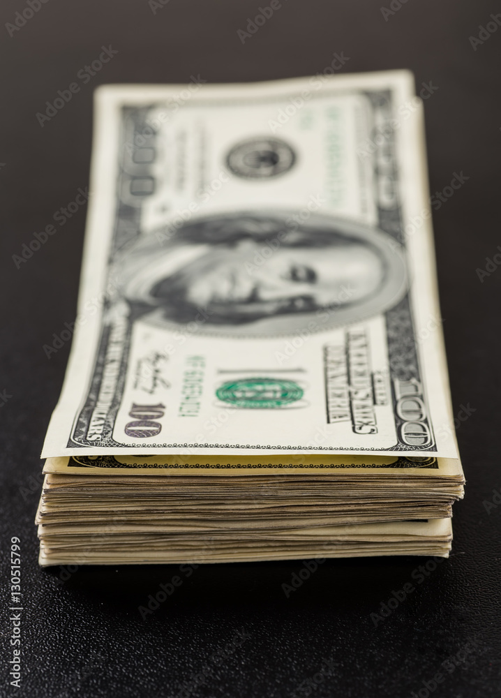 Stack of one hundred dollar bills close-up. Stack of one hundred dollar bills close-up.