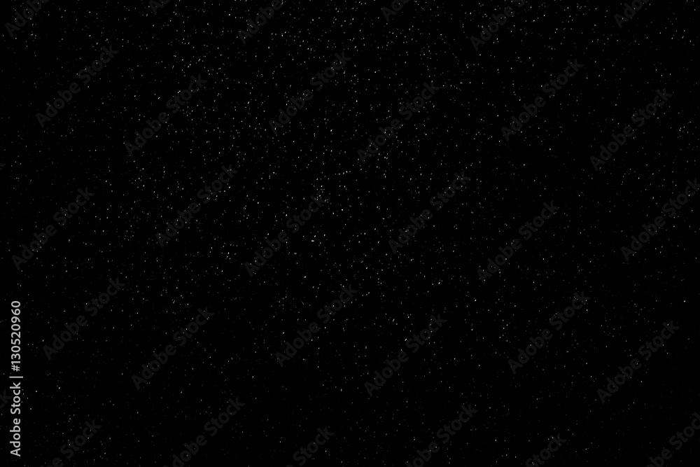 Rain or snow fall concept. Falling raindrops on black background