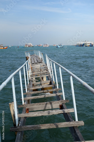 The wooden bridge extending into the sea