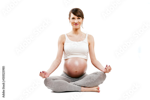 Meditating on maternity. Close-up of pregnant woman meditating w
