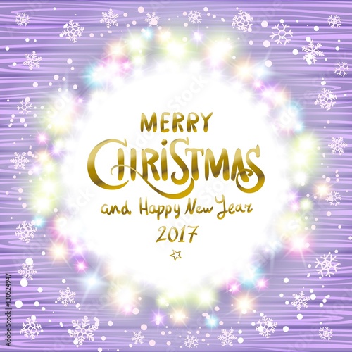 Merry Christmas and Happy New Year 2017. Glowing Christmas wreath made of led lights on the violet wooden background. Christmas lights background.