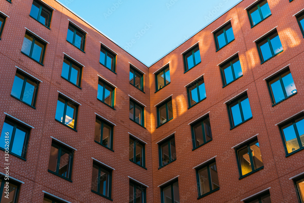 red brick building in a corner red brick building in a corner