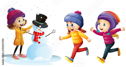 Three girls playing with snowman