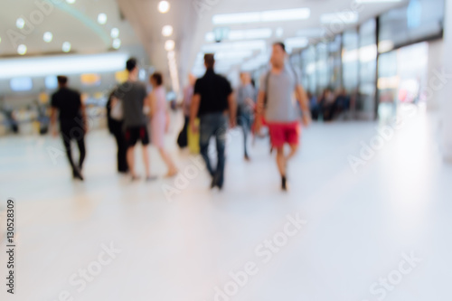 Blurred unidentified many people traveler at airport terminal for transport background