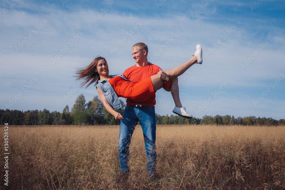 the loving couple walks on the wheat field the loving couple walks on the wheat field